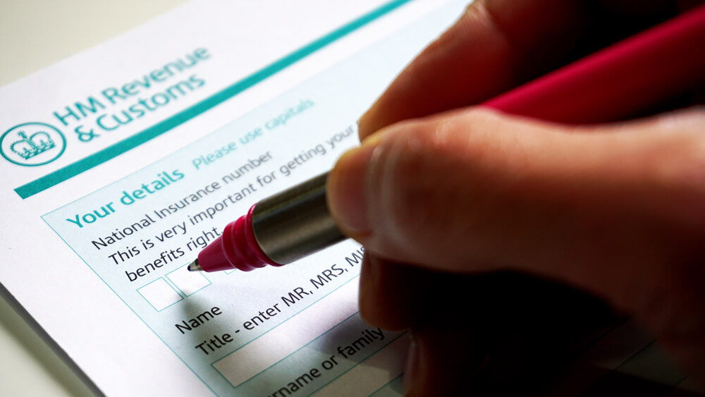 filling in a HM customs form a personal details for UK self assessment tax and benefits right.