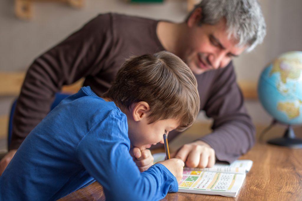 dad homeschooling son